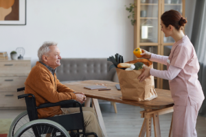 a nurse delivers groceries to a resident in assisted living in longview texas