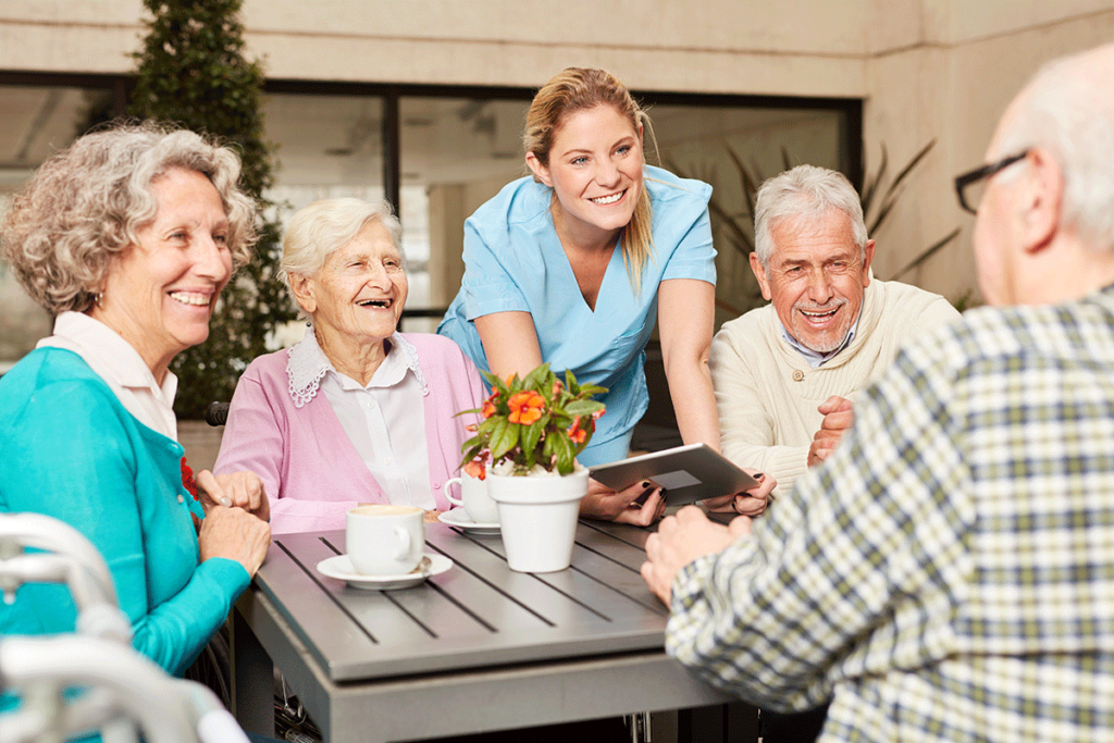 a group of independent seniors socialize in an assisted living program