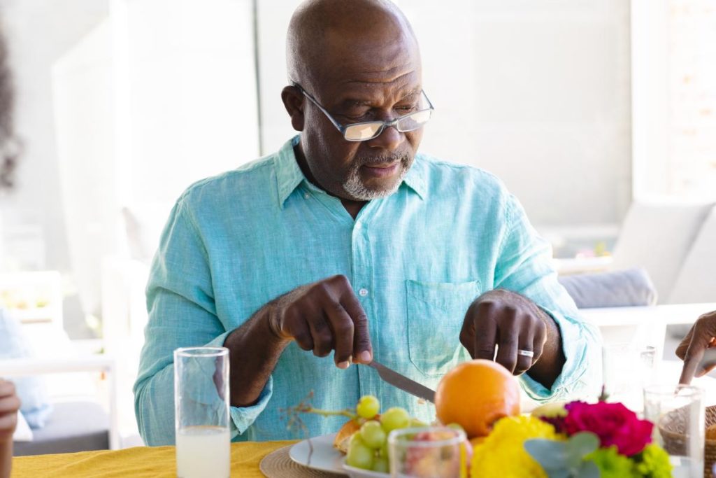 elderly man selecting from among the best foods for maintaining health in seniors