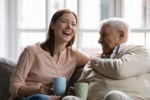 woman talking to her elderly father trying to learn how to handle elderly parents who refuse assisted living