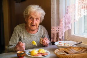 a senior eats one of many meals for elderly people who can't chew