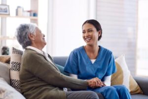 a nurse talks with a resident in senior memory care
