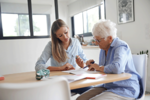 an older womans daughter helps her determine if she can afford a senior living community