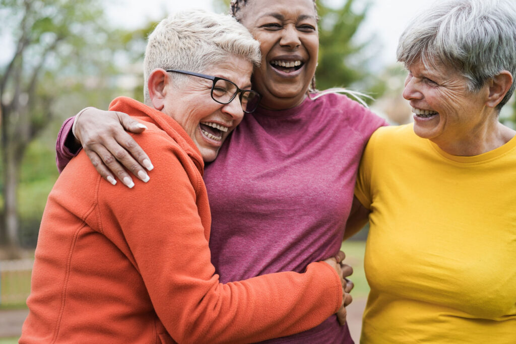 a group of senior friends greet each other