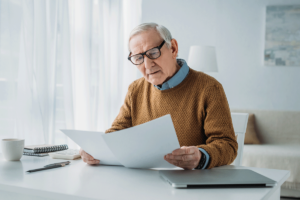 a senior man plans financially for a comfortable retirement